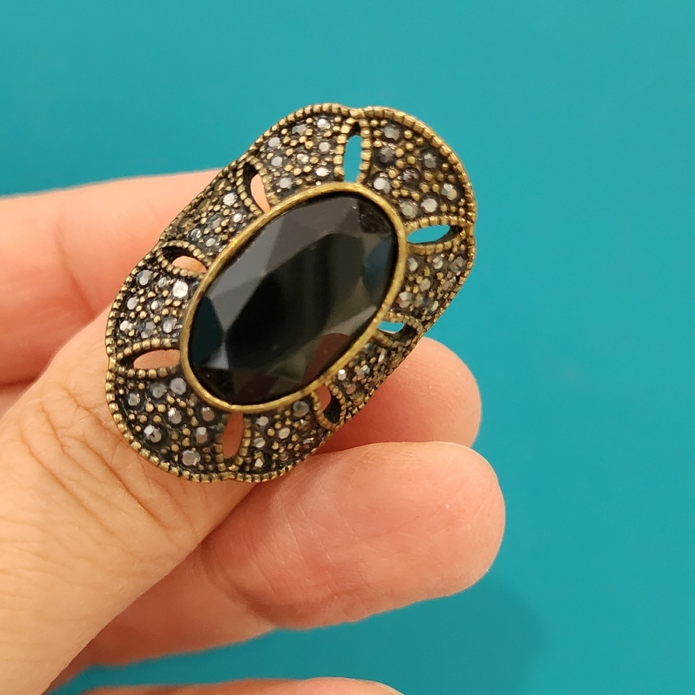 Antique gold tone oval black glass ring, size 7